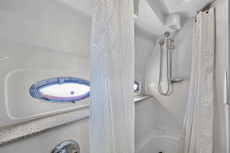 Slide: The Image of Shower area in 2003 Cruisers Yachts 4450 Express Motoryacht with porthole window. - 59