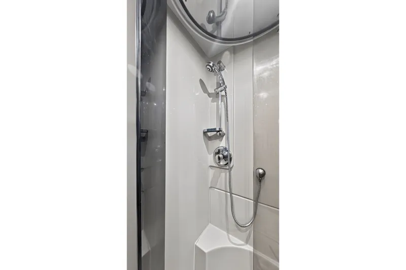 Slide: The Image of Shower area in 2003 Cruisers Yachts 4450 Express Motoryacht, featuring modern fixtures. - 42