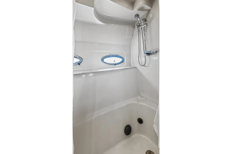 Slide: The Image of Shower area in 2003 Cruisers Yachts 4450 Express Motoryacht with porthole windows. - 61