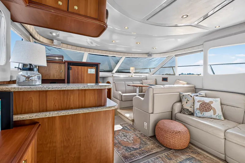 Slide: The Image of Luxurious interior of 2003 Cruisers Yachts 4450 Express Motoryacht with elegant seating and decor. - 32