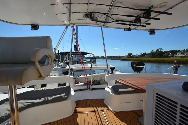 Slide: The Image of 2006 Fountaine Pajot LAVEZZI 40 catamaran interior with seating and fishing rods. - 20