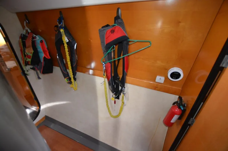 Slide: The Image of Life jackets hanging inside 2006 Fountaine Pajot LAVEZZI 40 catamaran cabin. - 33