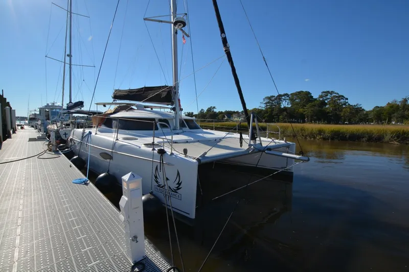 Slide: The Image of 2006 Fountaine Pajot LAVEZZI 40 catamaran docked on a sunny day. - 4