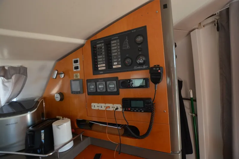 Slide: The Image of Control panel inside 2006 Fountaine Pajot LAVEZZI 40 catamaran, featuring navigation and communication equipment. - 27