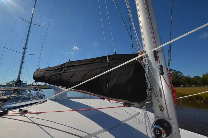 Slide: The Image of 2006 Fountaine Pajot LAVEZZI 40 sailboat mast and rigging under clear blue sky. - 37