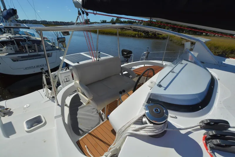 Slide: The Image of 2006 Fountaine Pajot LAVEZZI 40 catamaran cockpit with steering wheel and seating area. - 13