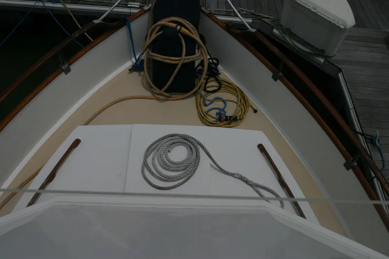 Slide: The Image of Bow of 1979 Grand Banks 42 Classic with ropes and dock equipment. - 8