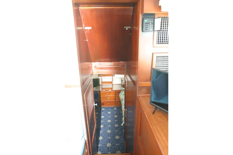 Slide: The Image of Interior view of 1979 Grand Banks 42 Classic yacht with wooden cabinetry and blue carpet. - 16