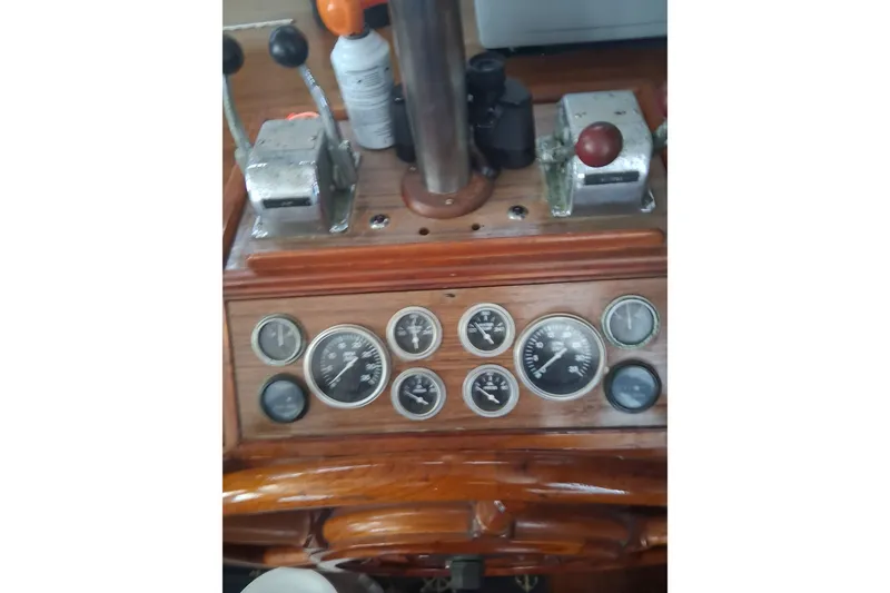 Slide: The Image of 1979 Grand Banks 42 Classic boat dashboard with gauges and controls. - 12