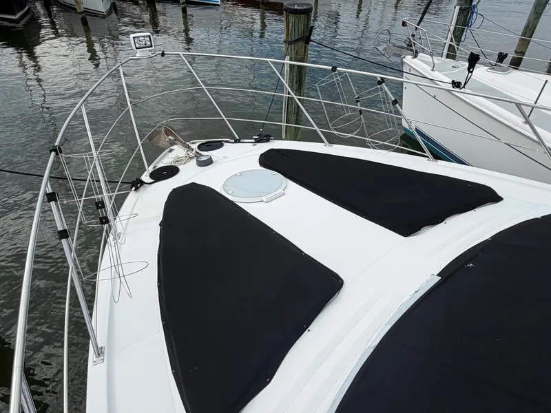 Slide: The Image of Foredeck of a 2002 Carver 396 Aft Cabin Motor Yacht with black covers. - 32