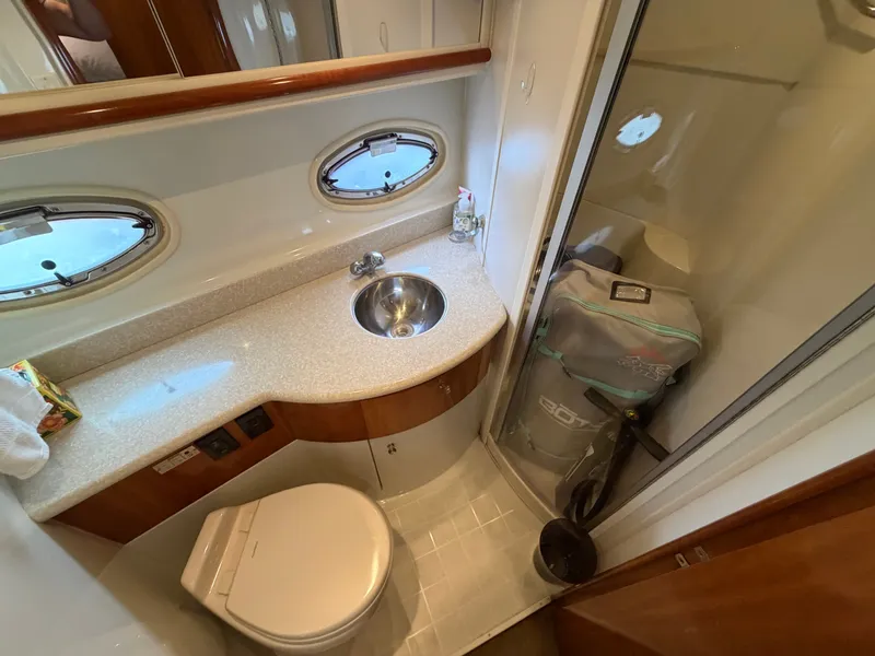 Slide: The Image of Bathroom with sink, toilet, and shower in a yacht cabin. - 26