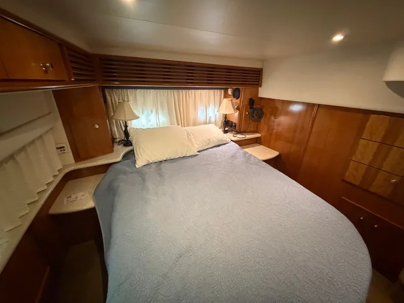 Slide: The Image of Cabin with a cozy bed, wooden furnishings, and soft lighting. - 24