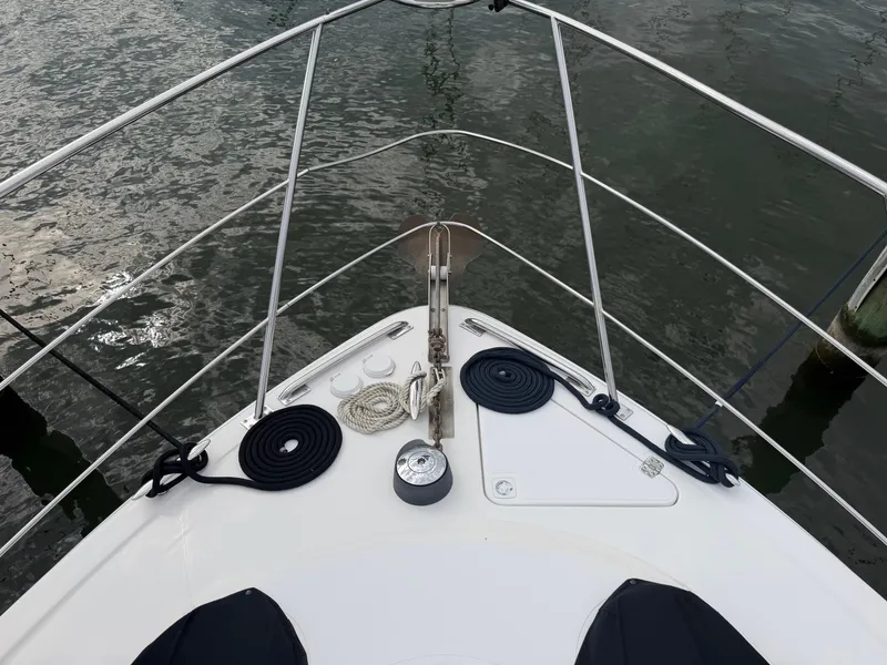 Slide: The Image of Bow view of a 2002 Carver 396 Aft Cabin Motor Yacht with anchor and ropes. - 33