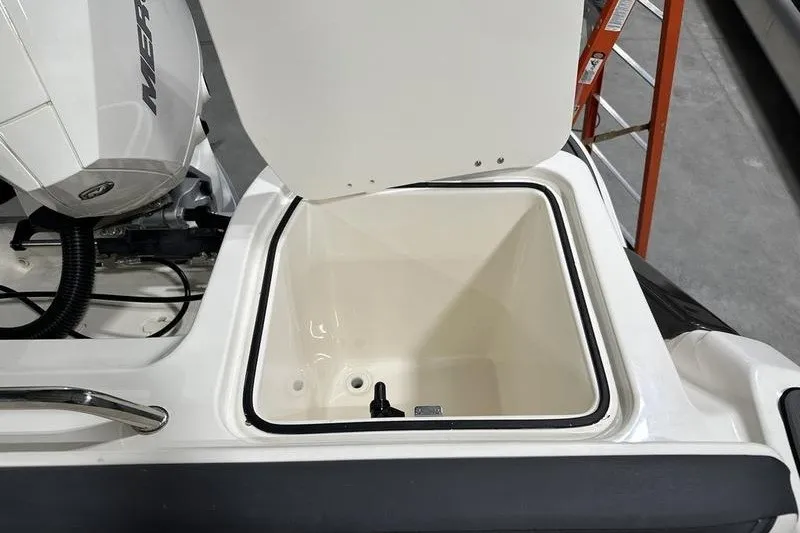 Slide: The Image of Open storage compartment on 2025 Bayliner Trophy T22SC boat, showcasing interior space. - 9
