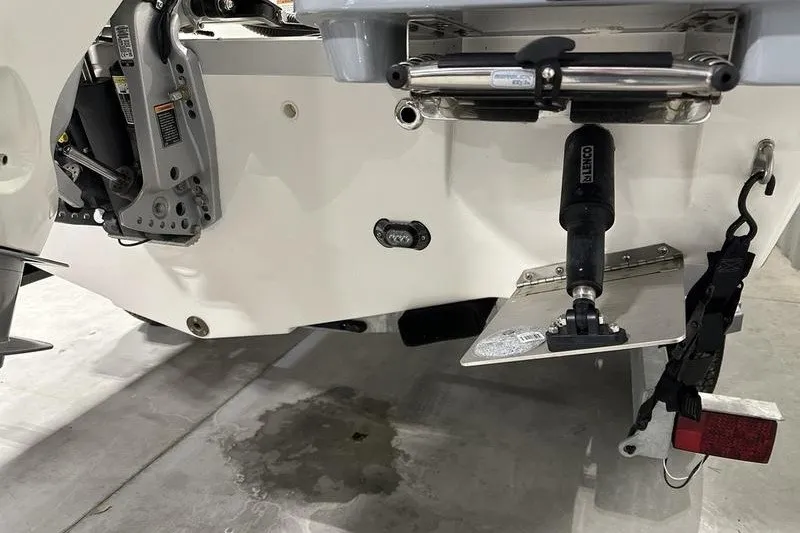 Slide: The Image of 2025 Bayliner Trophy T22SC boat transom with motor and trim tab details. - 5