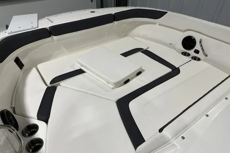 Slide: The Image of 2025 Bayliner Trophy T22SC boat interior with cushioned seating and cup holders. - 21