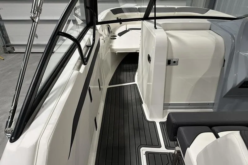 Slide: The Image of 2025 Bayliner Trophy T22SC boat interior with sleek seating and modern design. - 13