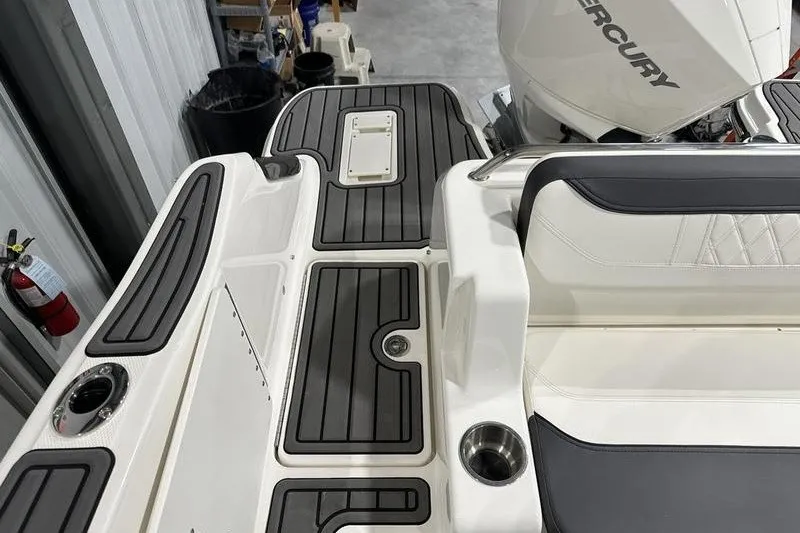 Slide: The Image of 2025 Bayliner Trophy T22SC boat interior with Mercury engine and sleek seating. - 10