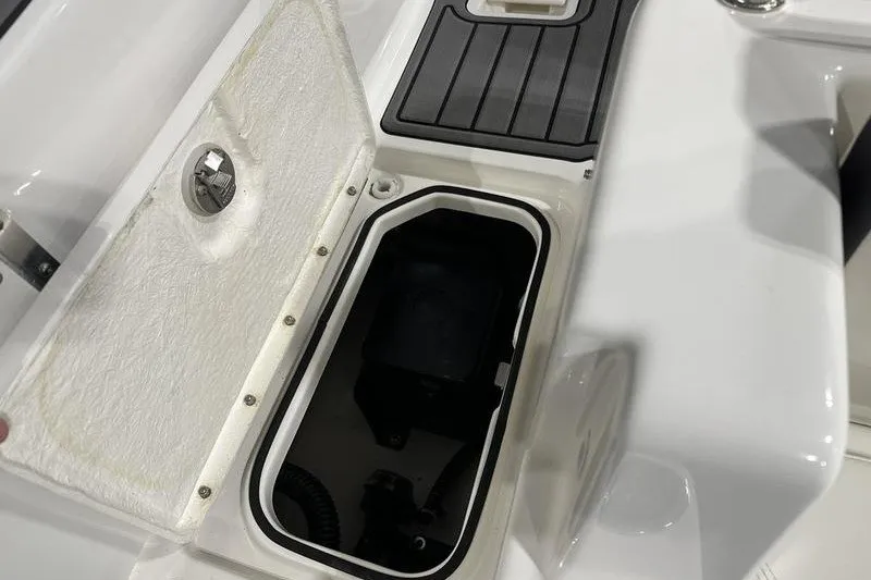 Slide: The Image of Open storage compartment on 2025 Bayliner Trophy T22SC boat deck. - 11
