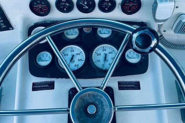 Slide: The Image of Steering wheel and gauges of a 1979 Bertram 31 Flybridge Cruiser. - 20