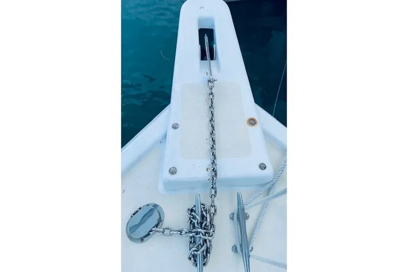 Slide: The Image of Bow of 1979 Bertram 31 Flybridge Cruiser with anchor chain and cleat. - 26
