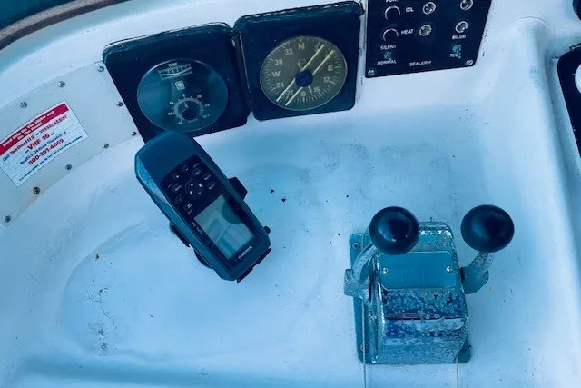 Slide: The Image of Control panel of a 1979 Bertram 31 Flybridge Cruiser with navigation instruments. - 24