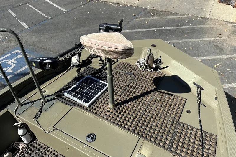 Slide: The Image of 2017 Tracker Grizzly 1860 MVX CC boat deck with seat, solar panel, and equipment. - 15