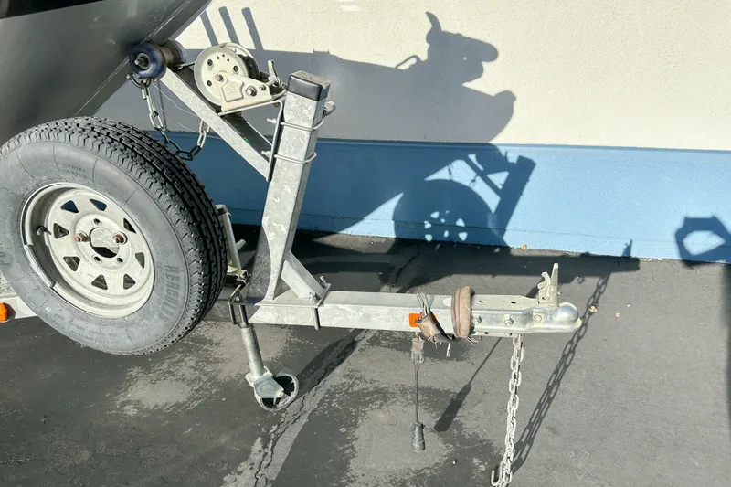 Slide: The Image of Trailer hitch and wheel of a 2008 Jetcraft 1925 Adventurer boat on pavement. - 4