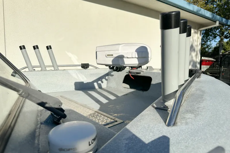 Slide: The Image of 2008 Jetcraft 1925 Adventurer boat deck with rod holders and GPS equipment. - 9