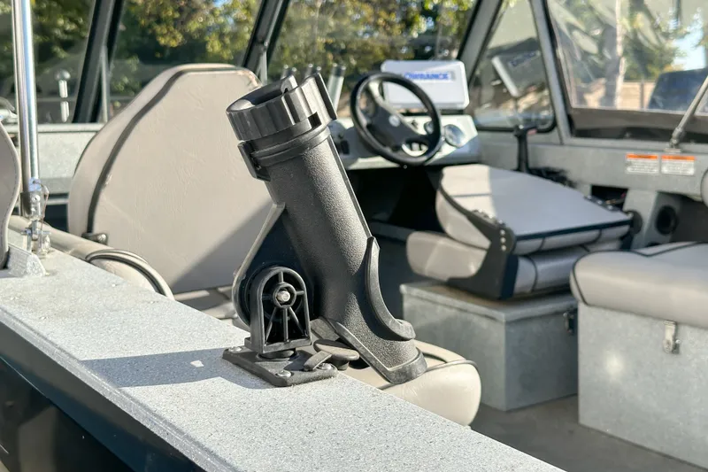 Slide: The Image of Interior of a 2008 Jetcraft 1925 Adventurer boat with rod holder and seating. - 11