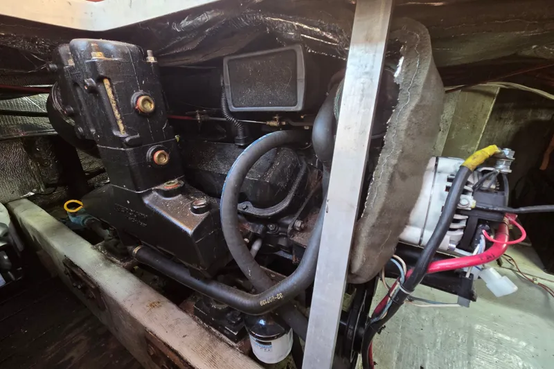Slide: The Image of Engine compartment of a 1998 Able Wolf Class 36 boat, showcasing mechanical components. - 21