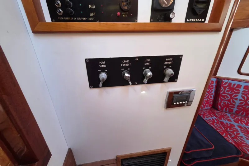 Slide: The Image of Control panel of a 1998 Able Wolf Class 36 yacht with switches and gauges. - 28