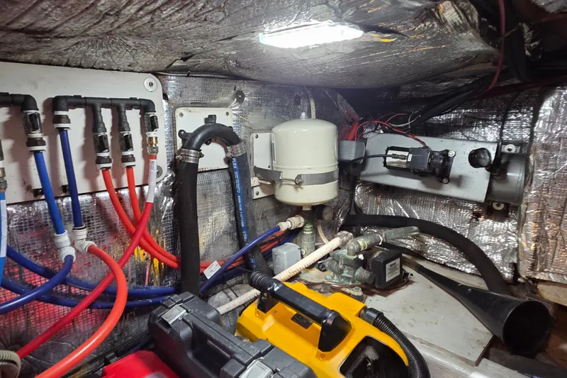 Slide: The Image of Engine room of 1998 Able Wolf Class 36 boat with wiring and components. - 25