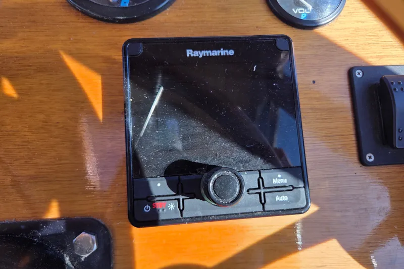 Slide: The Image of Raymarine control panel on Able Wolf Class 36 yacht, 1998 model, with wooden dashboard. - 16