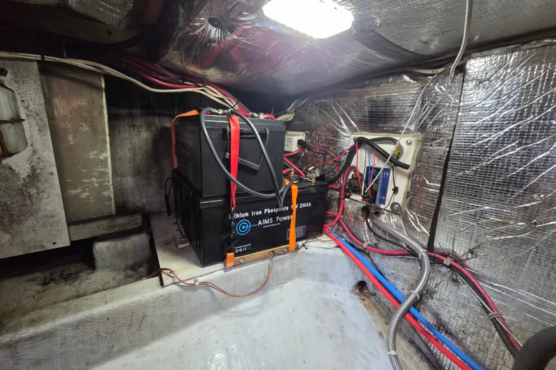 Slide: The Image of Battery setup in a 1998 Able Wolf Class 36 boat engine compartment. - 23