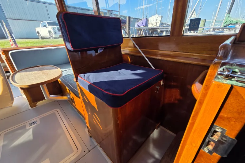 Slide: The Image of Interior of a 1998 Able Wolf Class 36 boat with wooden seating and table. - 20