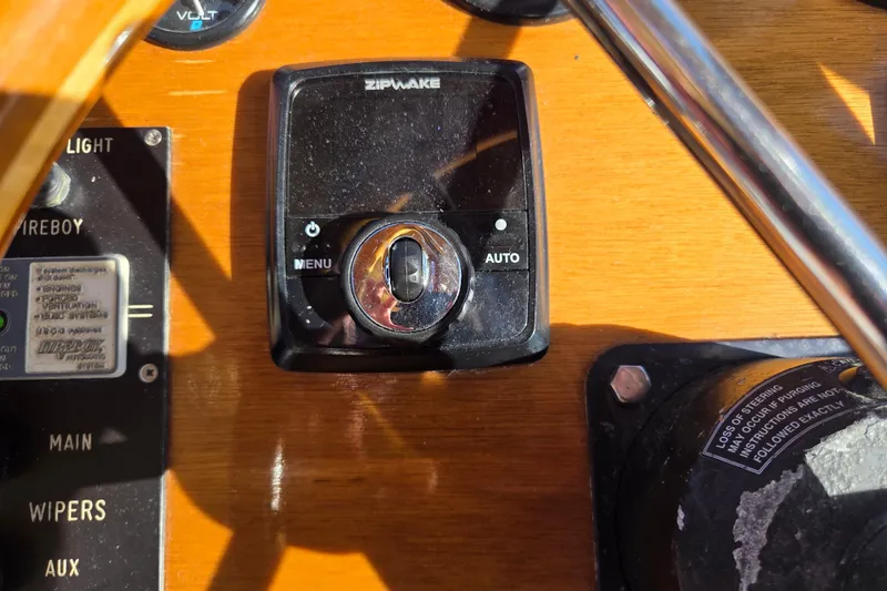 Slide: The Image of Control panel of a 1998 Able Wolf Class 36 boat with Zipwake system. - 17