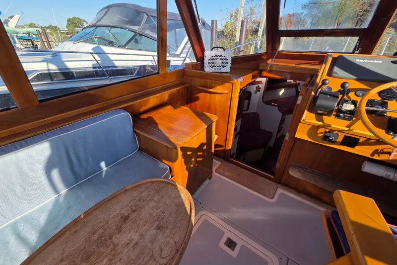 Slide: The Image of Interior of 1998 Able Wolf Class 36 boat with wooden accents and seating area. - 13