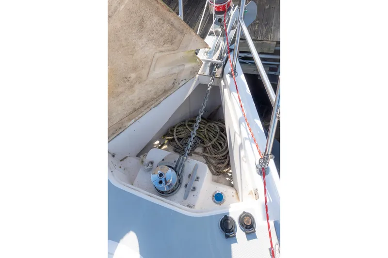 Slide: The Image of Anchor locker of a 2003 Hunter 356 sailboat with ropes and chain. - 9
