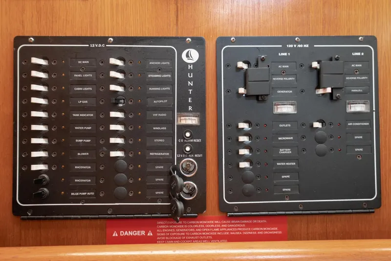 Slide: The Image of Electrical control panel on a 2003 Hunter 356 sailboat, featuring various switches and indicators. - 16