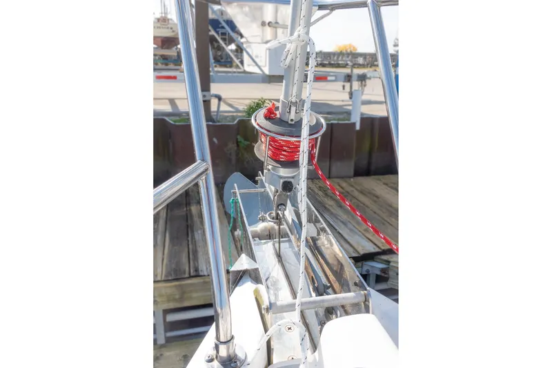 Slide: The Image of Bow of a 2003 Hunter 356 sailboat with rigging and dock background. - 6