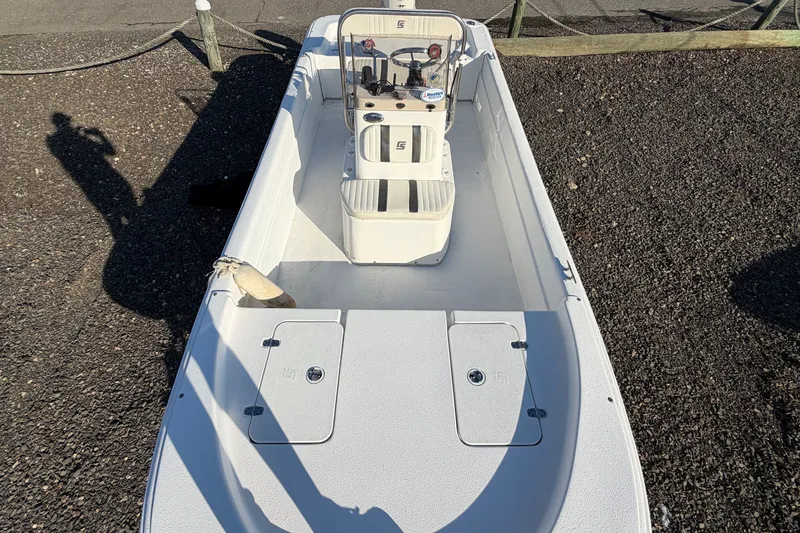 Slide: The Image of 2011 Carolina Skiff 18 JVX CC boat on gravel, top view. - 13