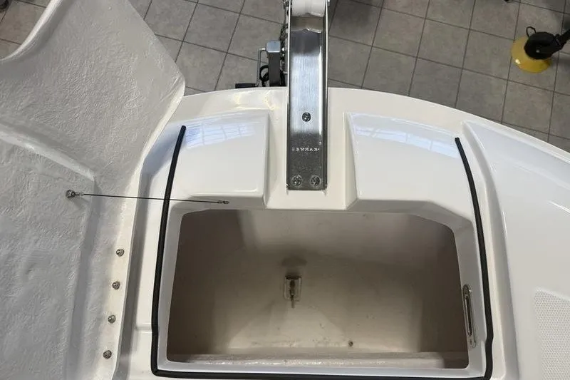 Slide: The Image of 2025 Bayliner Trophy T24CC boat storage compartment with stainless steel latch. - 22