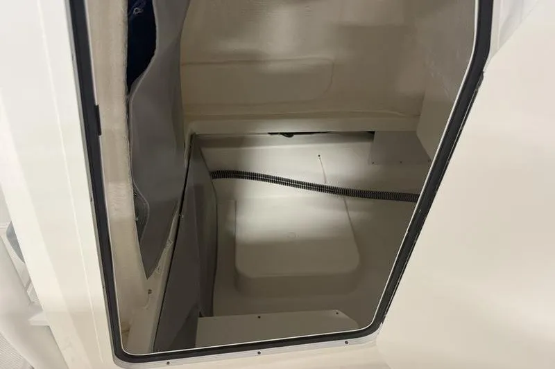 Slide: The Image of Interior view of 2025 Bayliner Trophy T24CC boat cabin space. - 23
