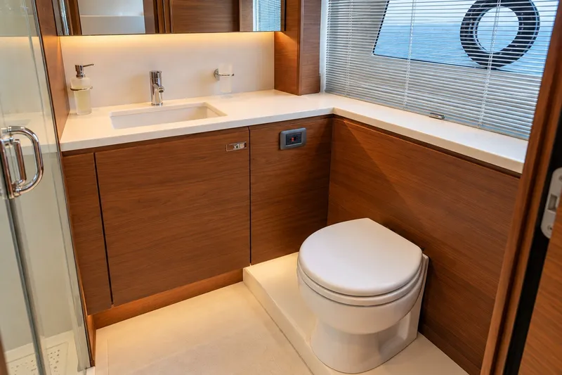 Slide: The Image of Luxurious bathroom interior on 2021 Princess Y85 yacht, featuring modern fixtures and wooden cabinetry. - 51