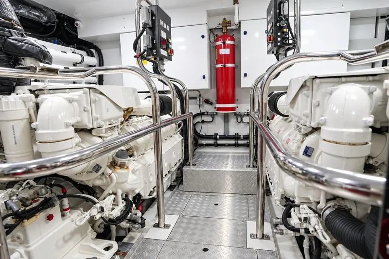 Slide: The Image of Engine room of 2021 Princess Y85 yacht, featuring advanced machinery and safety equipment. - 64