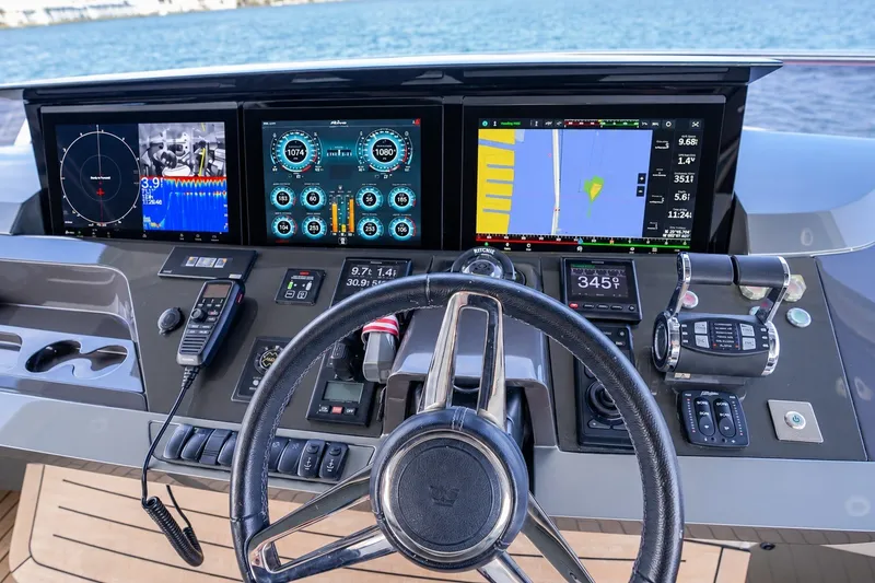 Slide: The Image of Cockpit of 2021 Princess Y85 yacht with advanced navigation displays and controls. - 22