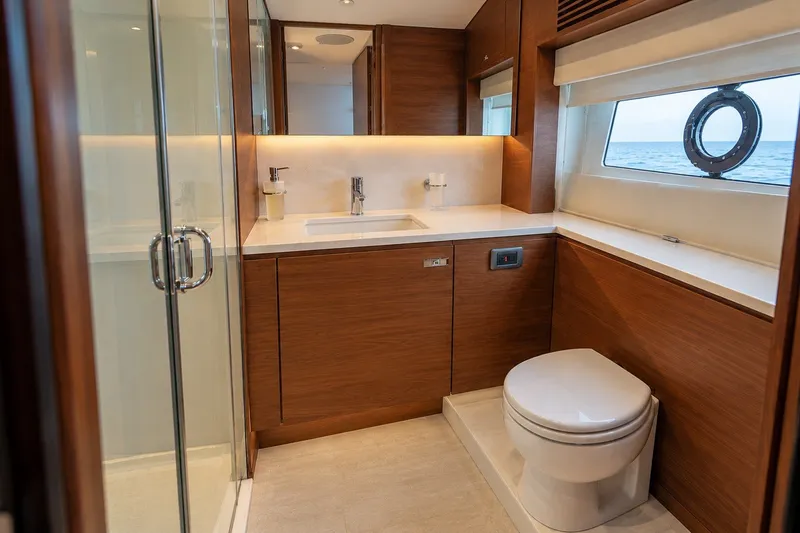 Slide: The Image of Luxurious bathroom on 2021 Princess Y85 yacht with wood accents and ocean view. - 56
