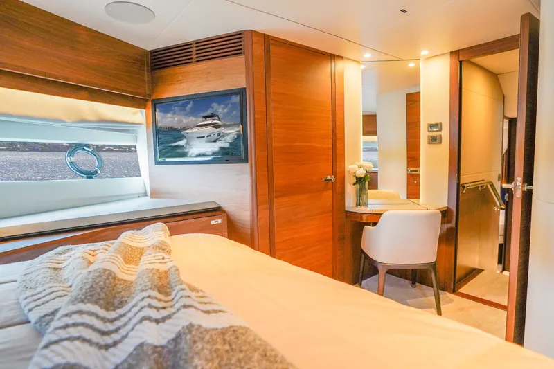Slide: The Image of Luxurious interior of 2021 Princess Y85 yacht with elegant wood finishes and cozy decor. - 49