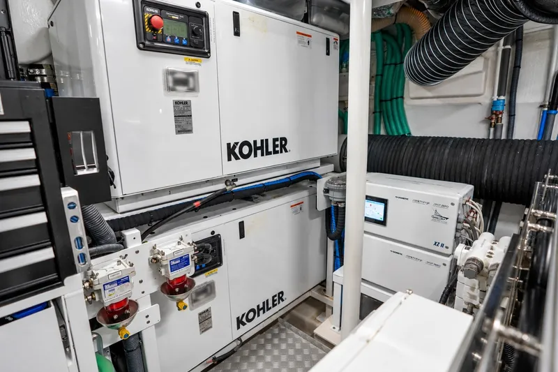 Slide: The Image of Engine room of 2021 Princess Y85 yacht featuring Kohler generators and advanced equipment. - 65